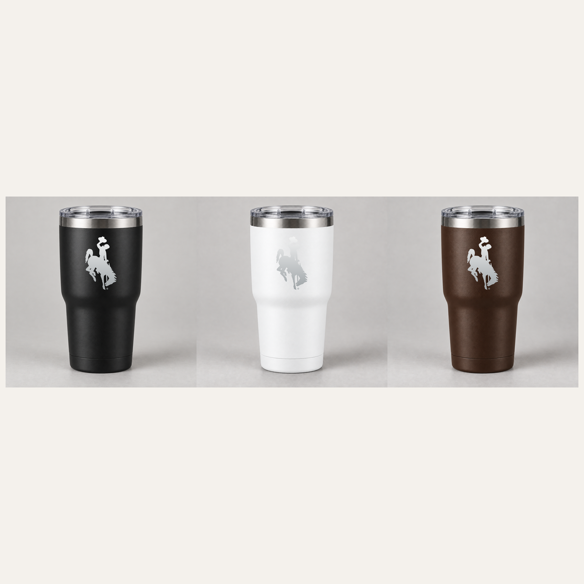 UW Bucking Horse 30 oz tumblers in black, white, and brown with aluminum engraving centered on upper section