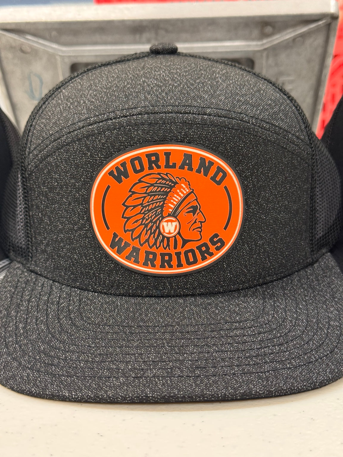Worland High School Warriors orange patch hat in black